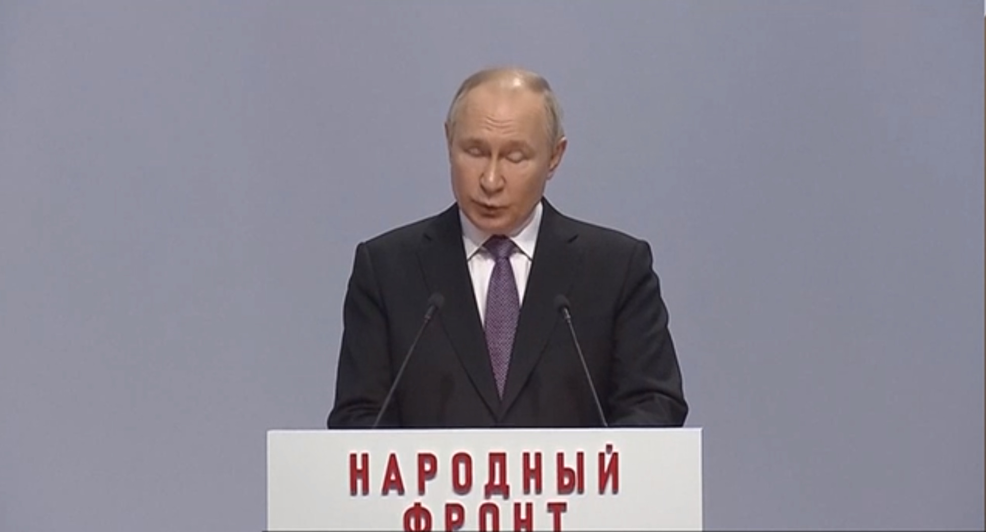 Russian President Vladimir Putin in an official setting, contemplating the recent stance taken by France